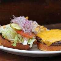 Cheeseburger · Half-pound beef patty, cheese, lettuce, tomato, pickles, and red onion. Served with your cho...