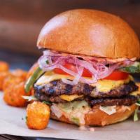 All-American Burger · Two grilled quarter-pound beef patties, American cheese, shredded lettuce, tomato, red onion...