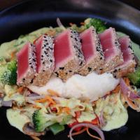 Sesame Crusted Ahi Tuna · Seared medium-rare sashimi grade yellowfin tuna, cauliflower mash, seasonal vegetables, coco...