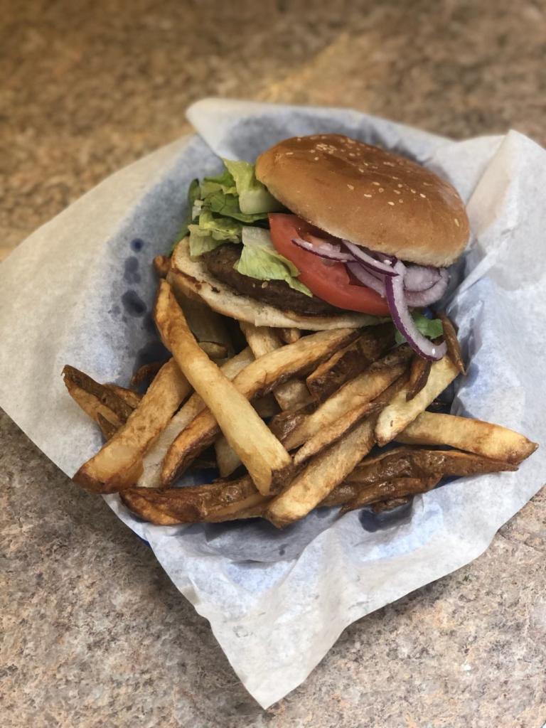 Hamburger - with fresh cut fries · Beef patty topped with mustard, mayo, onions, lettuce, and tomatoes on a bun. Served w/ fresh cut fries.  