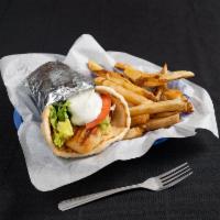 Tilapia Wrap - with fresh cut fries · Char-broiled tilapia filet topped with lettuce, tomatoes, tzatziki sauce wrapped in pita. Se...