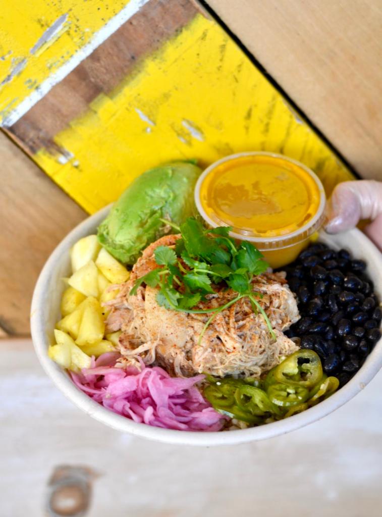 Mexi-Cali · Chicken, black beans, roasted corn, pineapple, avocado, pickled red onion, cilantro, roasted carrot and cumin dressing