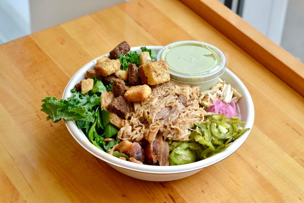 Kale Yeah · Chicken, edamame, bacon, pickled red onion, almonds, croutons and green goddess dressing.