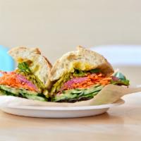 Veggie Sandwich · Smashed avocado, carrots, cucumber, pickled red onions, pepperoncini, greens, carrot-cumin d...