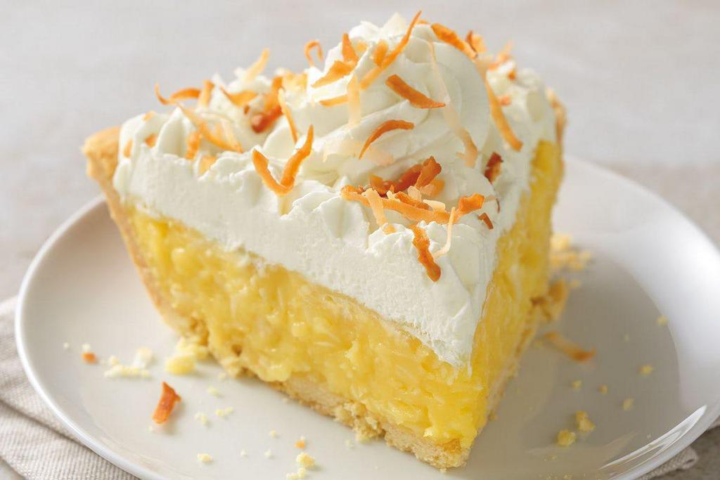 Whole Coconut Cream Pie · A buttery vanilla cream filling blended with shredded coconut, then topped with real whipped cream and toasted coconut shavings inside our award-winning pastry crust.