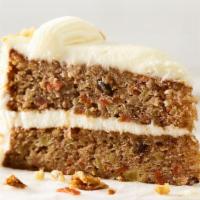Carrot Cake Slice · Two-layer cake with shredded carrots, pineapple, sweetened coconut and pecan pieces, covered...