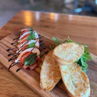 Caprese Salad · Buffalo mozzarella cheese with basil. Baguette toasted bread with arugula, topped with balsa...
