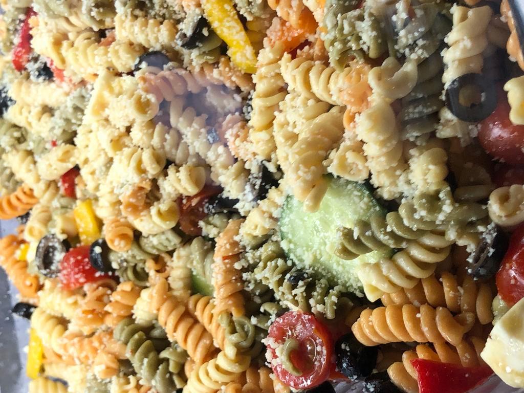 PASTA SALAD (8 OZ) · An amazing tricolor rotini with cherry tomatoes, cucumber, sweet peppers, black olives, all mixed in a zesty Italian.