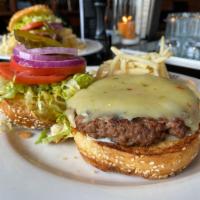 The Impossible Burger · Hardwood grilled, plant based patty, topped with pepper Jack cheese, mustard, mayonnaise, le...
