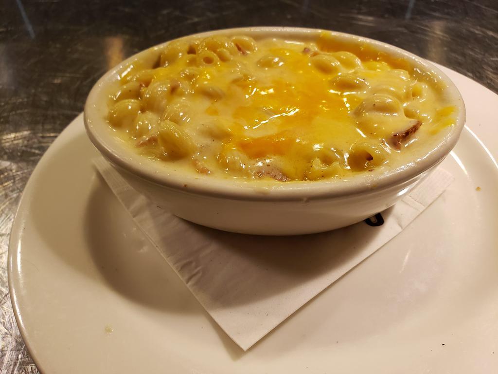 Bacon Mac and Cheese · Diced onion, applewood bacon, and cayenne pepper tossed with sharp white cheddar cheese, cream cheese, and spiral noodles, topped with smoked cheddar cheese, and baked until golden brown 