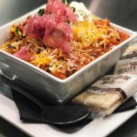 Loaded Turkey Chili · Cheddar cheese, pickled onions,sour cream, Fresno chilies, crackers 