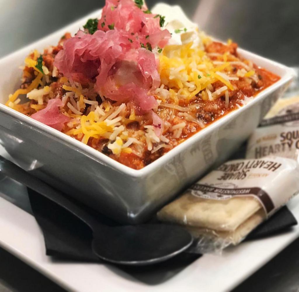 Loaded Turkey Chili · Cheddar cheese, pickled onions,sour cream, Fresno chilies, crackers 