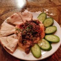 Hummus Small Tapa · Fresh house-made chickpea hummus, served with pita bread, fresh cucumber, and choice of spic...