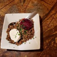 Lentejas Small Tapa · Warm lentils with marinated beets and goat cheese.