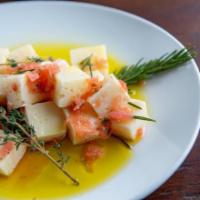 Marinated Manchego · Spanish manchego marinated in extra virgin olive oil with thyme and rosemary.