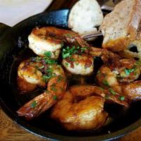 Gambas Al Pil Pil · 5 jumbo shrimp sautéed in garlic, dried chilies, and paprika served in a sizzling skillet.