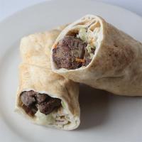 Shish Kabob Pita Wrap · Charcoal-broiled beef with tahini sauce, lettuce, cucumbers, shredded carrots, shredded red ...
