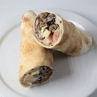 Beef Shawarma Pita Wrap · Slices of seasoned sirloin beef cooked rotisserie-style with tahini sauce, lettuce, cucumber...