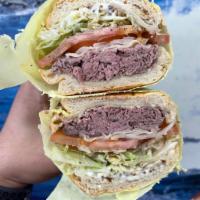 Roast Beef and Provolone · Sliced beef roasted in house provolone cheese, made the Brooklyn style with tomatoes, lettuc...