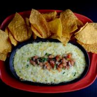 Azteca Queso Dip Dinner · Dip into a warm blend of selected cheeses, spinach and chiles. All baked together and served...