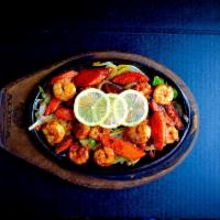 Shrimp Fajitas Dinner · Shrimp fajitas are served sizzling hot over a bed of sauteed onions and green peppers with r...