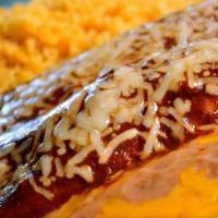 Enchiladas en Mole · 2 enchiladas are served with Mexican or white rice and choice of rice and beans.