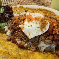 Patacon Antioqueno · Patacon topped with white rice, ground beef, ground pork rinds, red beans, creole sauce, and...