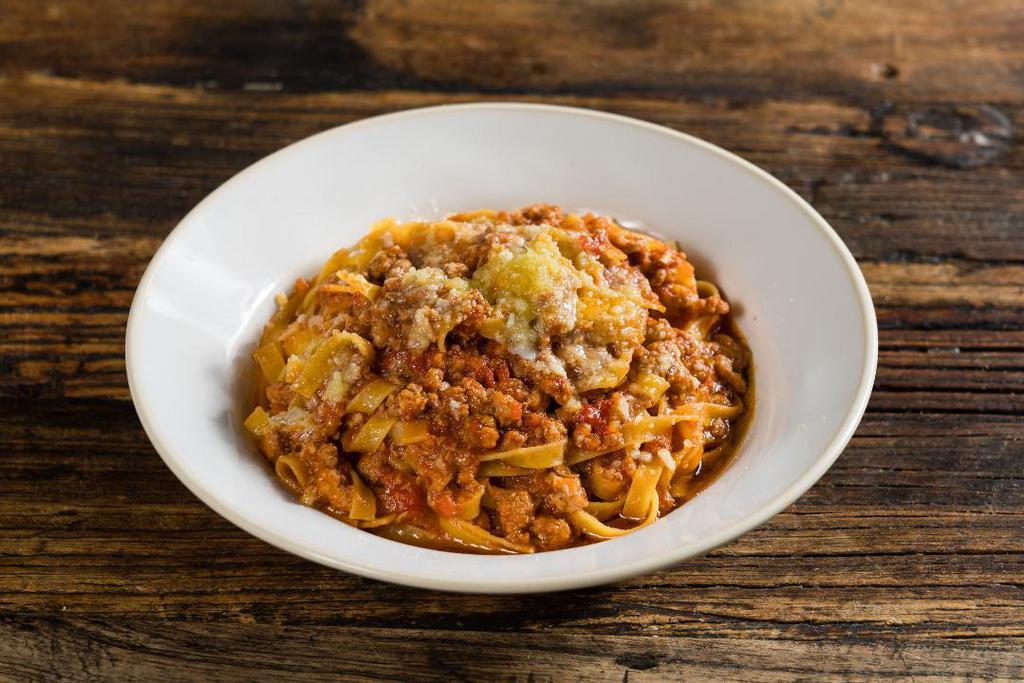 Fettuccine Alla Bolognese · traditional veal ragù, 24-month aged Parmigiano-Reggiano