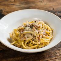 Spaghetti Alla Carbonara* · homemade spaghetti, eggs, cream, Pecorino Romano, Parmigiano-Reggiano, crispy bacon.  * Cons...