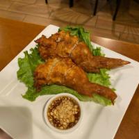 24. Phig Gai Somrram · De-boned chicken wings stuffed with chicken, baby shrimp, carrot, mushrooms and glass noodle...