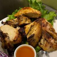 26. Gai Yang · 1/2 grilled and sliced chicken marinated in our Thai BBQ sauce: a unique blend of spices and...