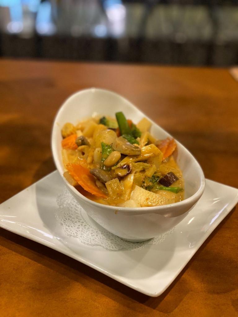 31. Kaeng Mussamun Curry ·  Mussamun sauce in coconut cream, whole roasted peanuts, potatoes and carrots. Mild. Gluten-free.