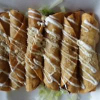 Taquitos · Deep fried flour tortillas filled with a great tasting. Topped with sour cream, guacamole, a...