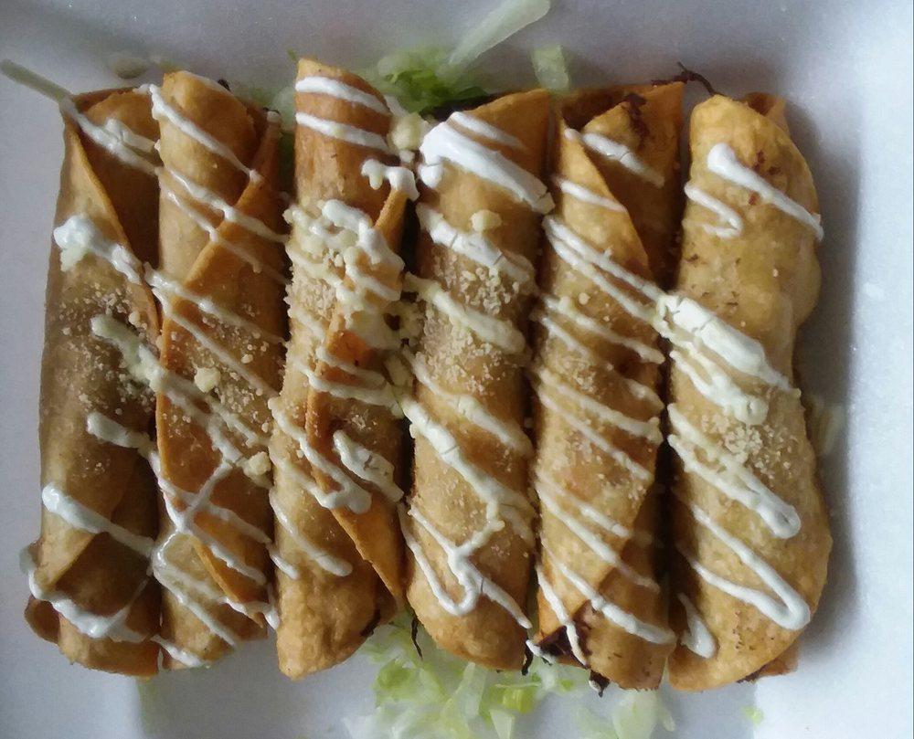 Taquitos · Deep fried flour tortillas filled with a great tasting. Topped with sour cream, guacamole, and Parmesan cheese.
