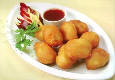 Sweet and Sour Chicken · Lightly battered chicken with  sweet and sour sauce on the size