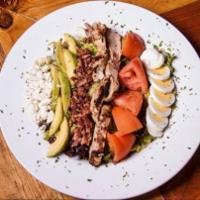 Chicken Cobb Salad · Grilled and chilled thinly sliced chicken with mixed greens tossed in a roasted garlic vinai...