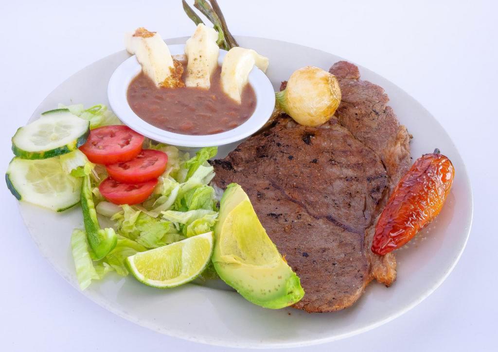 Carne Asada  · Grilled steak, chile toreado, cambray onion, salad, rice, beans and tortillas.