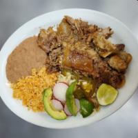 Carnitas Plate · Juicy yet crispy BBQ-style pork served with beans, rice, and tortillas.