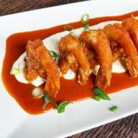 Crispy Buffalo Shrimp Appetizer · Lightly fried, jumbo shrimp tossed in buffalo sauce. Served on our famous bleu cheese dressi...