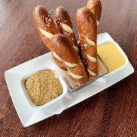 Pretzel Sticks Appetizer · Soft baked, salted pretzel sticks served with our house-made Northern Lager infused cheese s...
