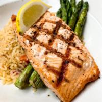 Grilled Salmon · Charbroiled Atlantic salmon, with rice pilaf and asparagus.
