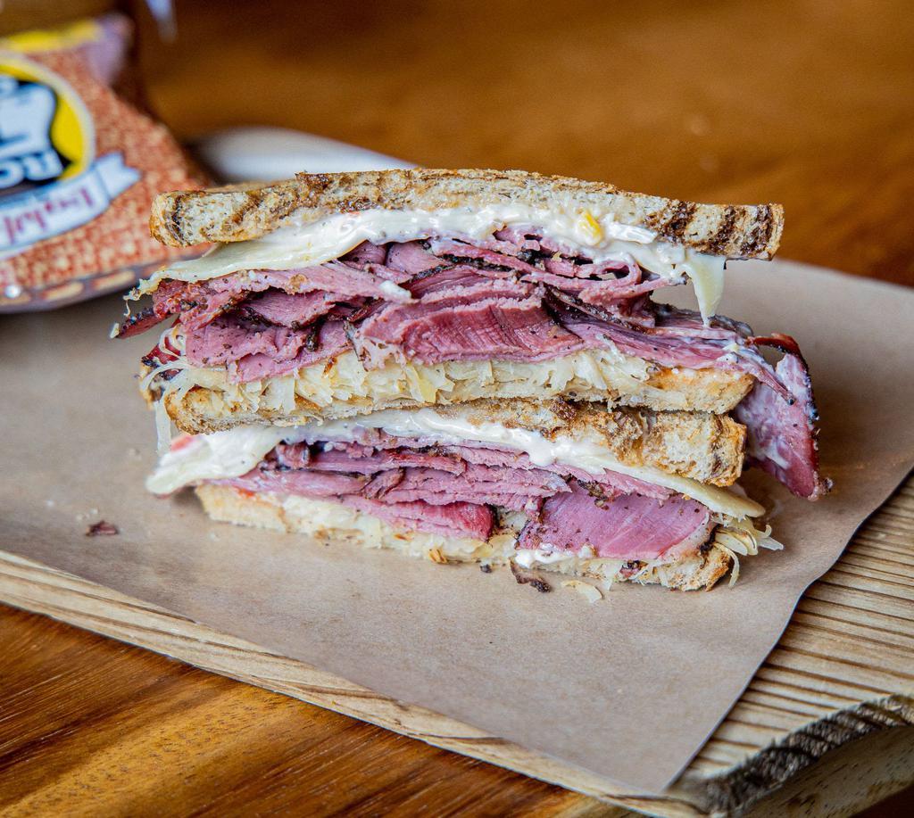 Pastrami Reuben · Boar's Head pastrami, sauerkraut, Swiss cheese, our thousand island dressing on a marble rye bread