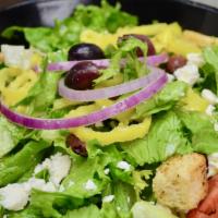 Greek Salad · Served with tomatoes, red onions, Kalamata olives, green peppers, banana peppers and feta on...