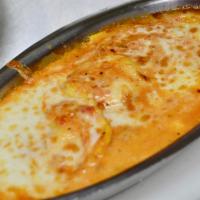 Lobster Ravioli · Pillows of pasta filled with lobster, smothered with our homemade marinara and lightly baked...