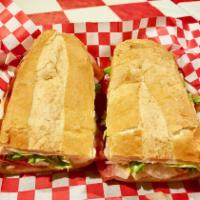 Italian Sub · Served hot or cold with sliced salami, ham, pepperoni, provolone, lettuce, tomatoes, white o...