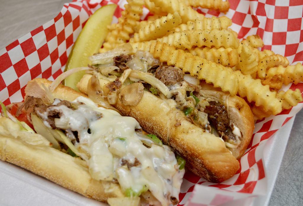 Johny D's Philly Steak Sub · Slices of Philly steak cooked with grilled onions, mushrooms and peppers topped with melted mozzarella and lettuce, tomatoes and mayo. Served on a fresh hoagie roll.