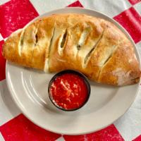 Calzones · Mozzarella and ricotta cheese with choice of 1 topping, served with a side of homemade marin...