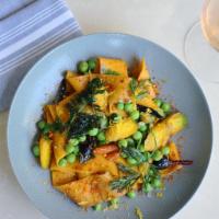 Vegan Carrot Pappardelle Pasta · peas, roasted carrots, green garlic, thyme, cardamom oil, duhuka