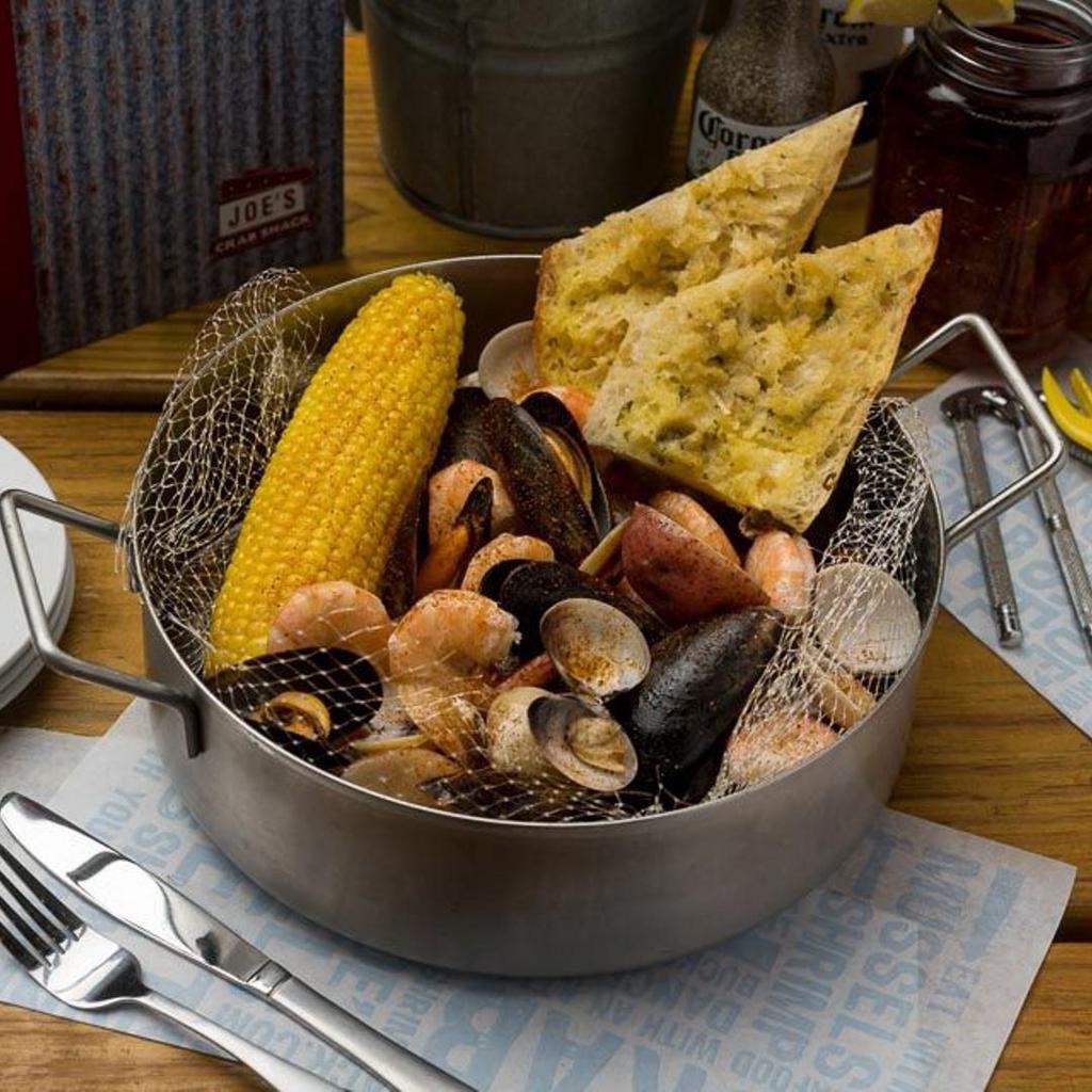 Steamer Steampot · Mussels, clams, shrimp, garlic seasoning, with garlic bread. This item can be prepared gluten free.