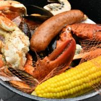 Cajun Steampot · Snow Crab, cold water lobster claws, shrimp, mussels, smoked sausage, Ragin' Cajun.